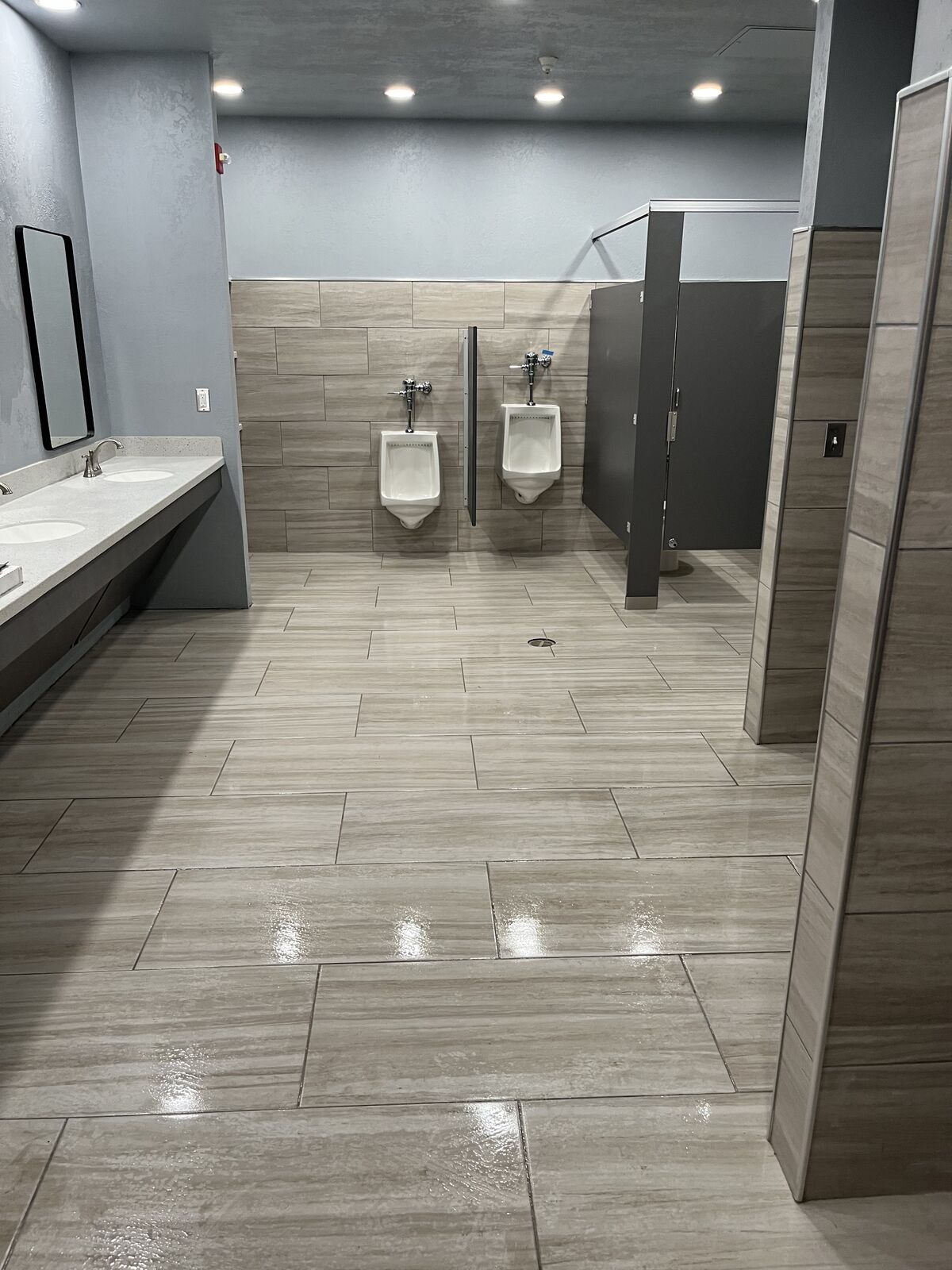 Commercial restroom remodel with large-format tile completed by Smith Construction in Oklahoma
