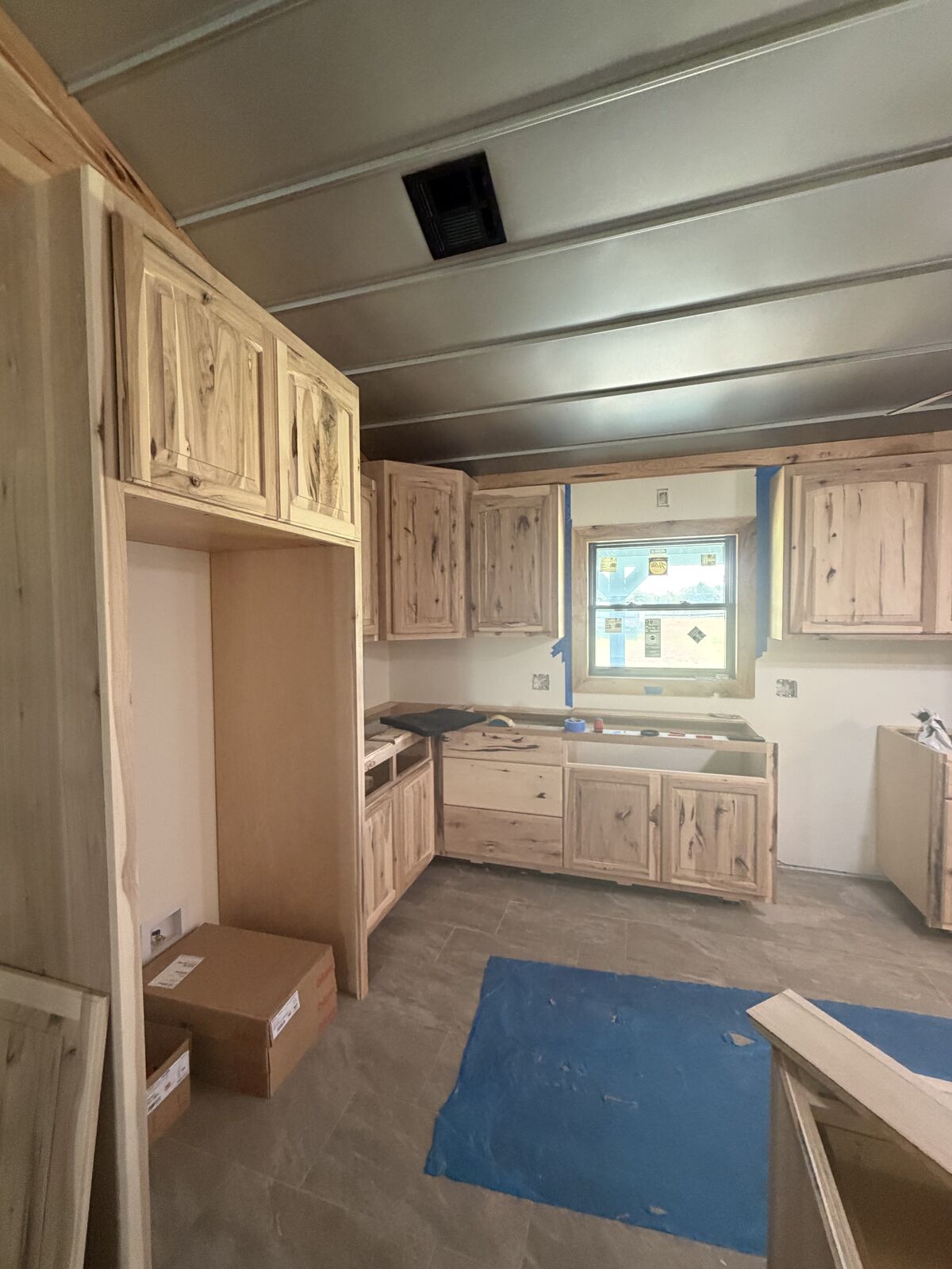 Custom hickory kitchen cabinet installation in progress near Wewoka, OK