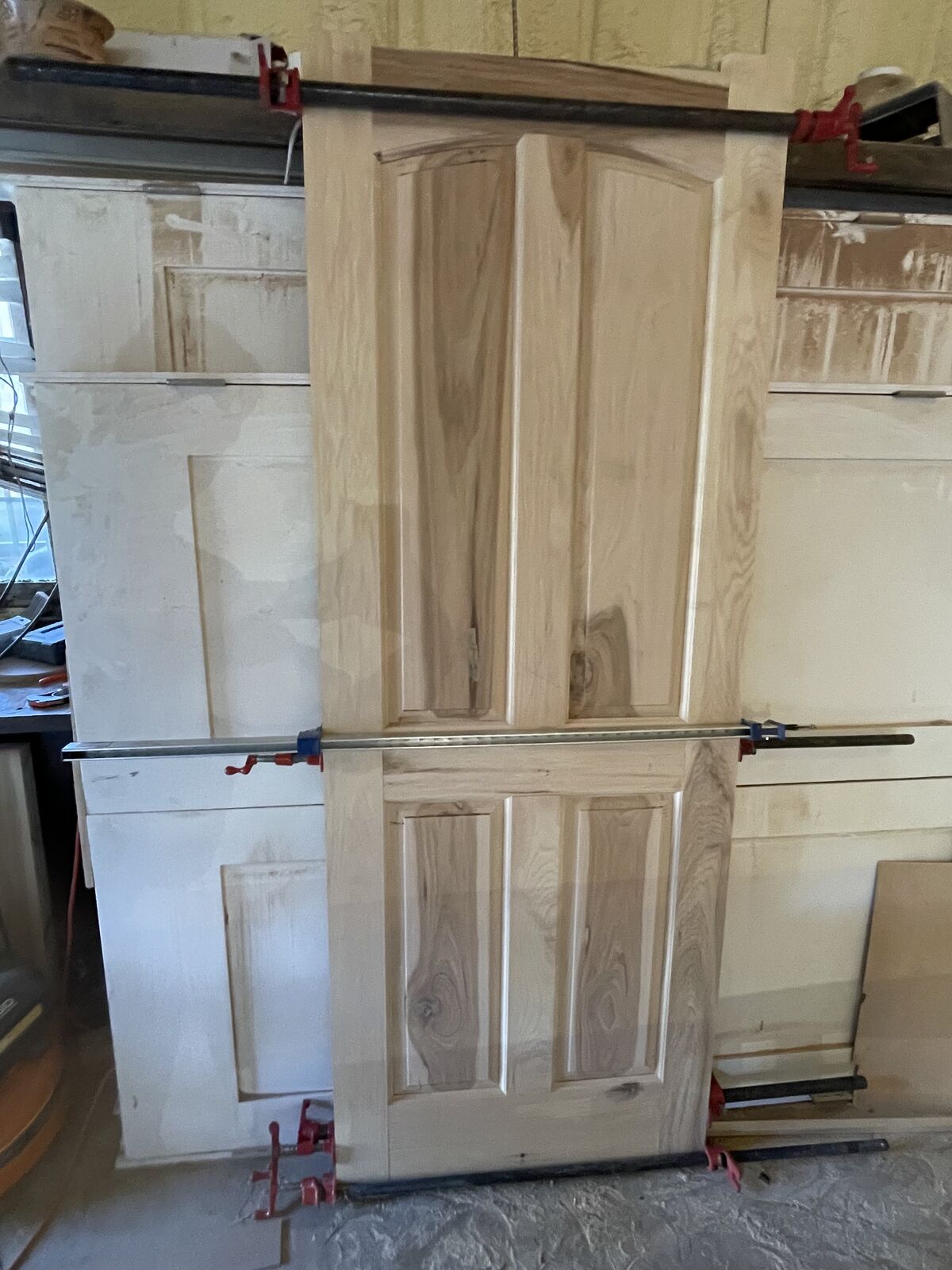 Handcrafted custom hickory door built in-house by Smith Construction Services