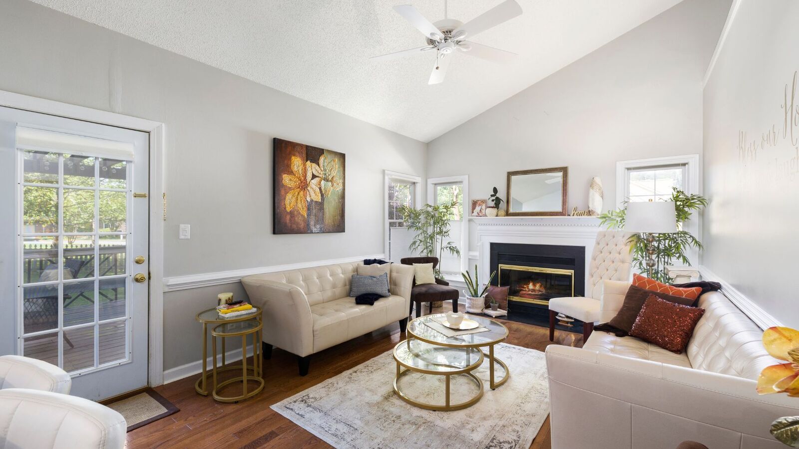 Bright family room renovation with fireplace and vaulted ceiling