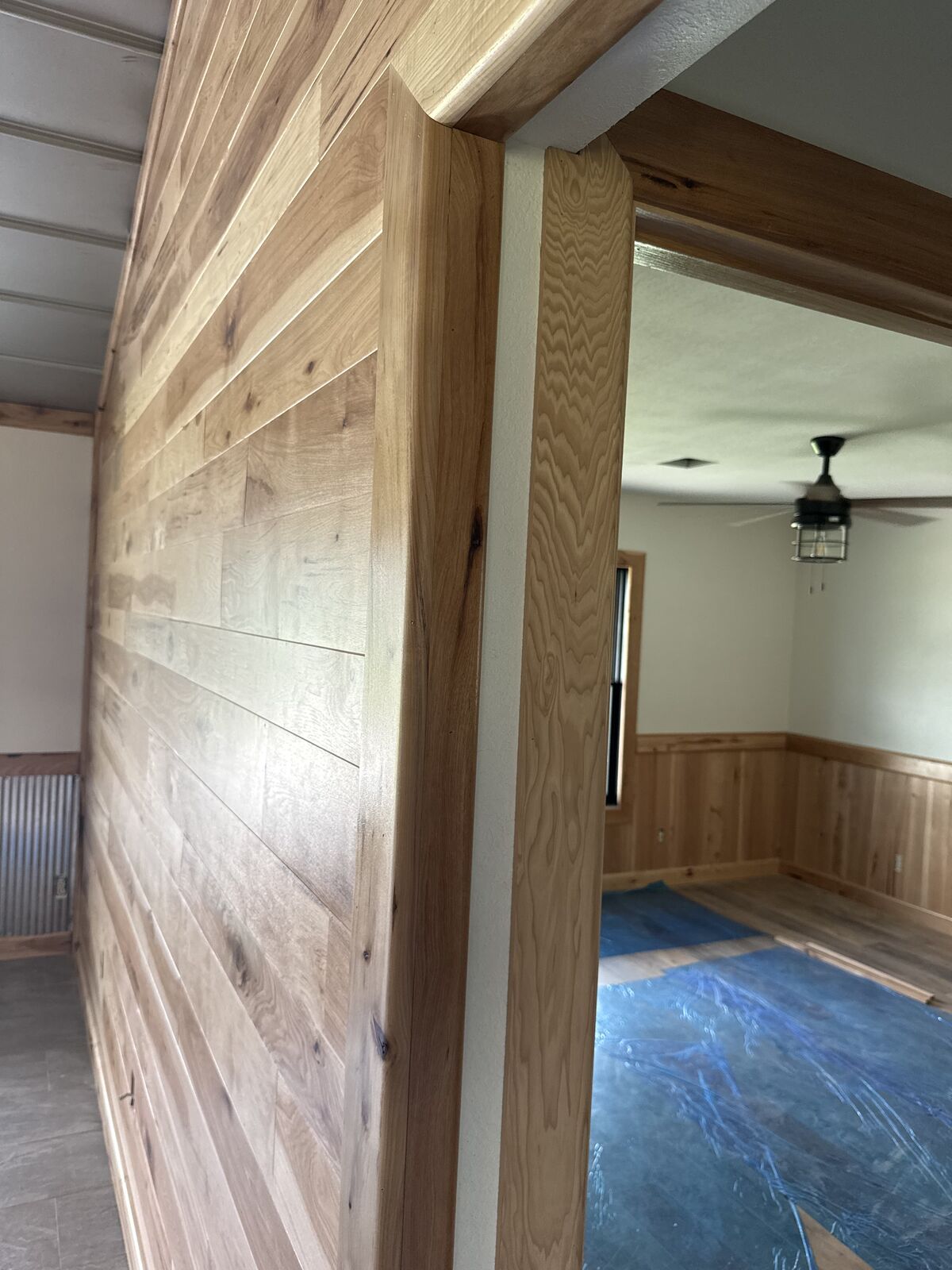 Custom hickory shiplap wall and trim carpentry in an Oklahoma home remodel