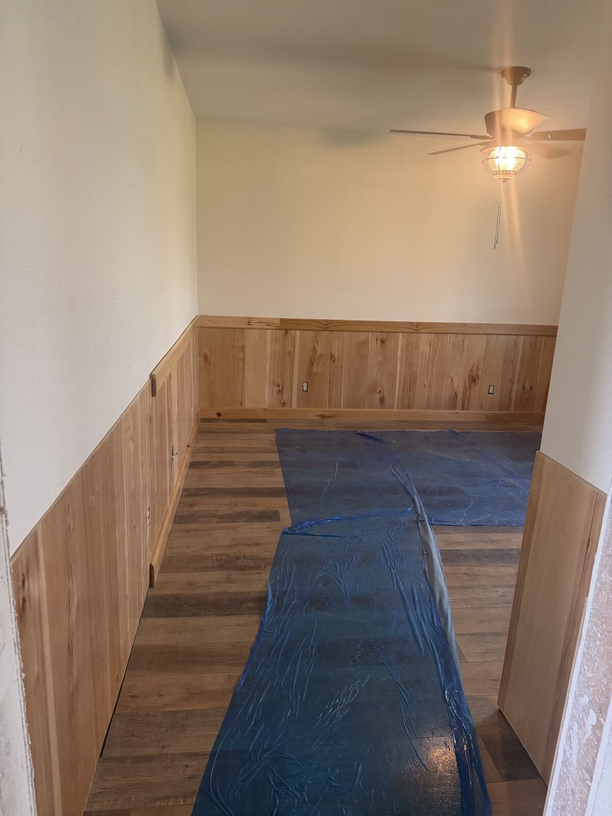 Hickory wainscoting and new flooring installed during a whole-home remodel in Oklahoma