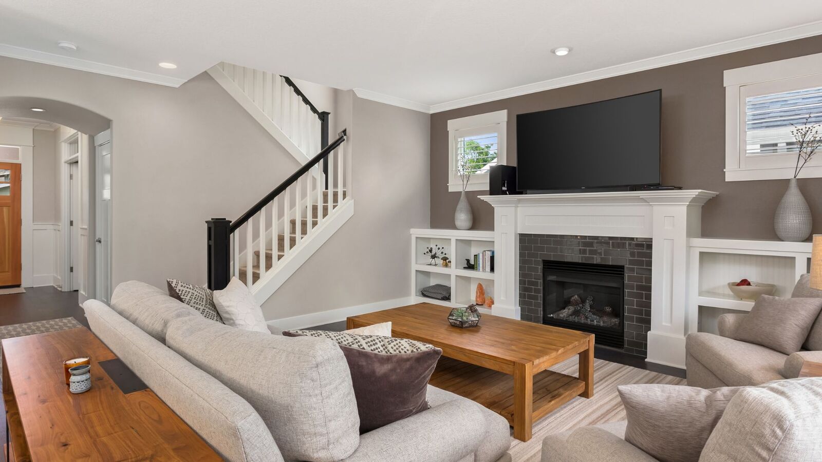 Whole-home renovation with open living room and updated staircase