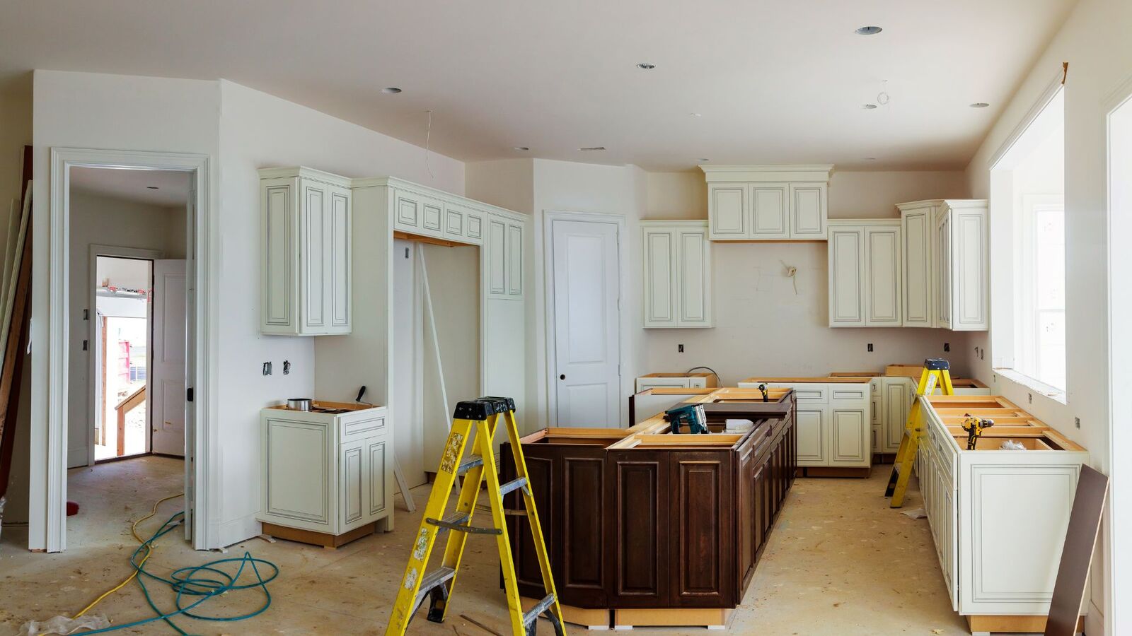 Kitchen remodel in progress with new cabinets being installed