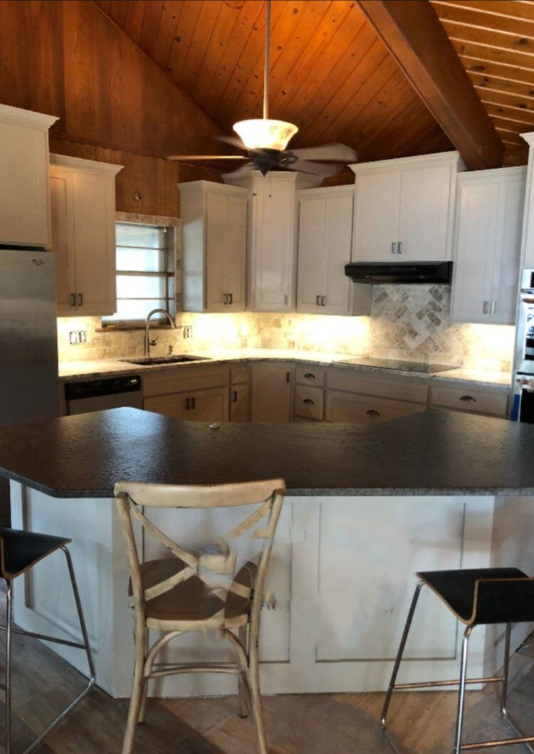 Kitchen remodel with white cabinets and vaulted wood ceiling near Wewoka, OK