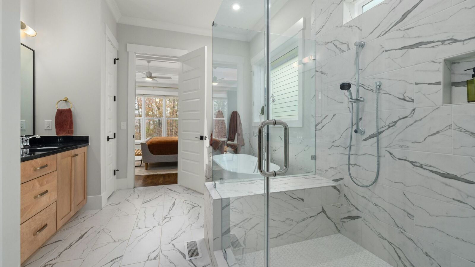 Master bathroom remodel with marble shower and freestanding tub